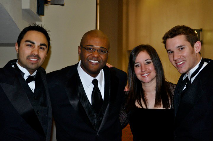 Band staff in formal attire at an end-of-year event.